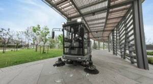 Application of Kärcher KM 210/180 R Classic Ride-On Sweeper at parks.